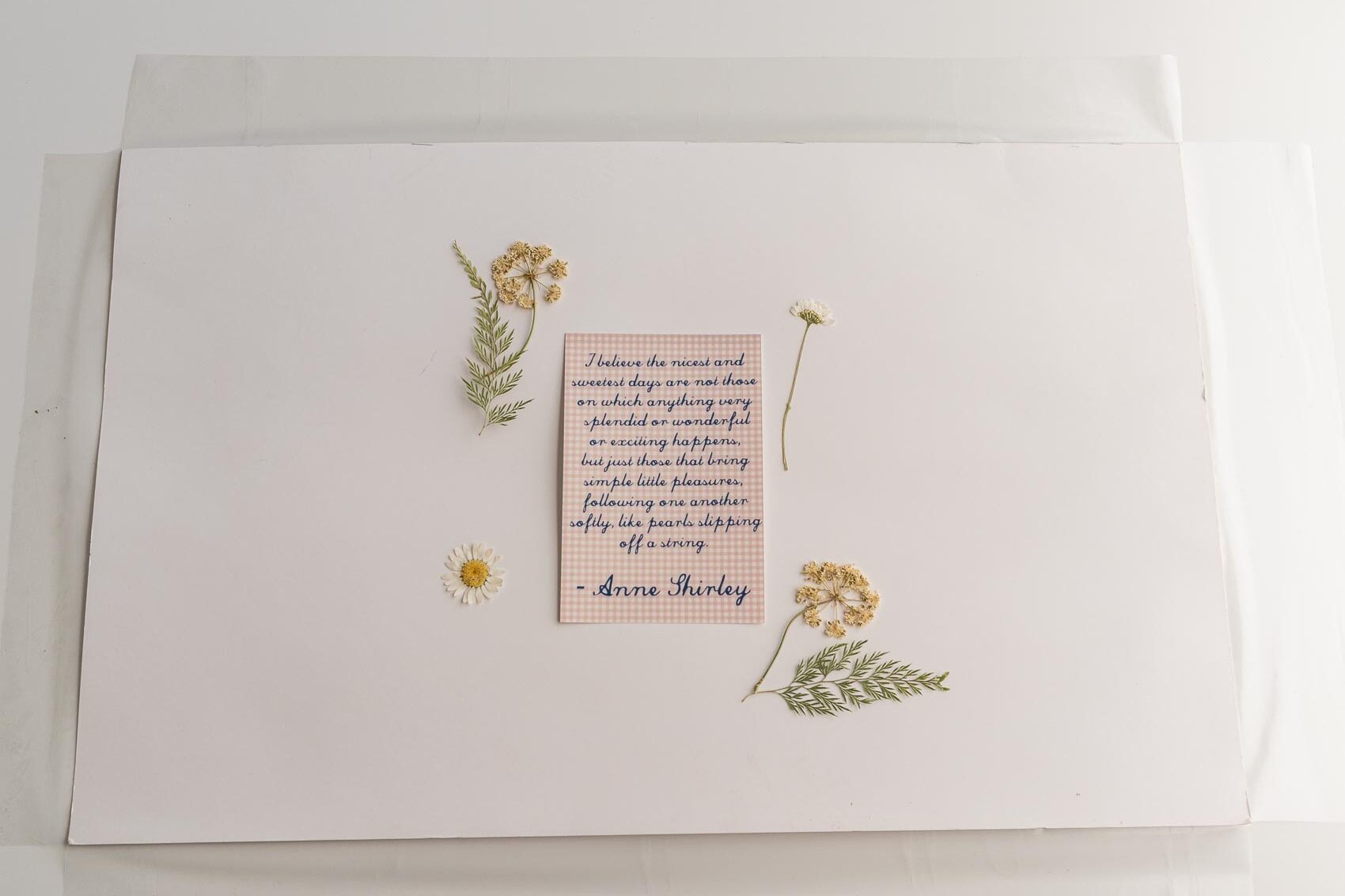 Process shot of folding contact paper over the back of placemat.