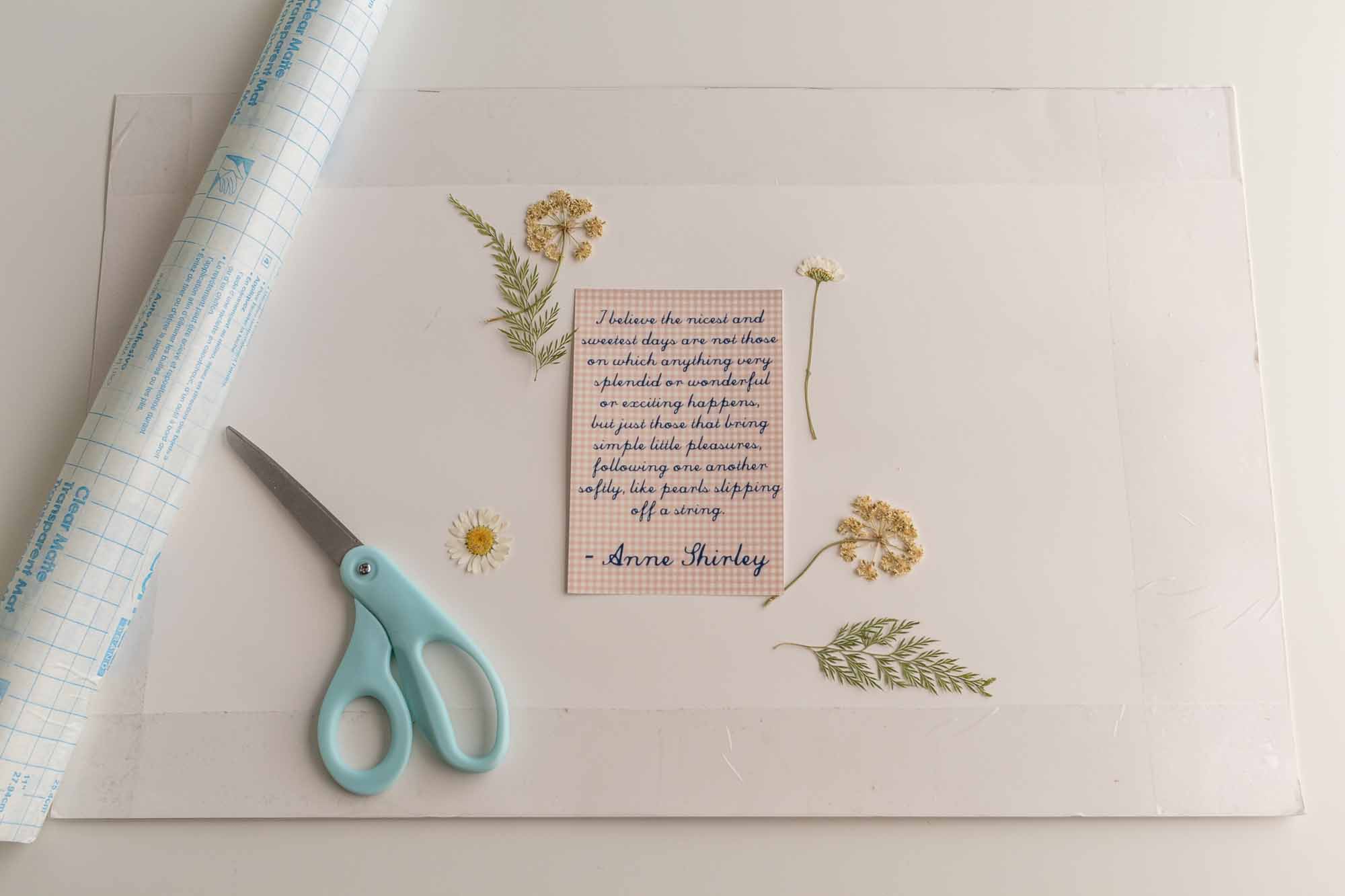 Process shot of contact paper folded over to the back of the placemat.